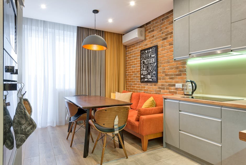 pexels-photo-6969987-6969987 Modern kitchen with brick wall and minimalist furniture in a cozy apartment.